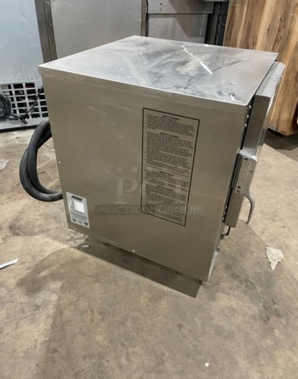 AccuTemp Evolution Series stainless steel electric countertop boilerless steamer, model E62083E15000250, on legs, with pan rack.