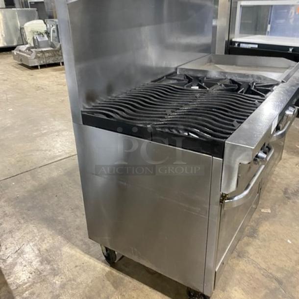 Southbend commercial stainless steel gas range with 6 burners, 24" griddle, double oven, backsplash, overhead salamander shelf, and casters.