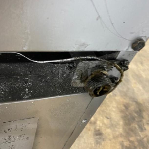 Southbend commercial stainless steel gas range close-up, showing detail of a connection point, possibly for maintenance.