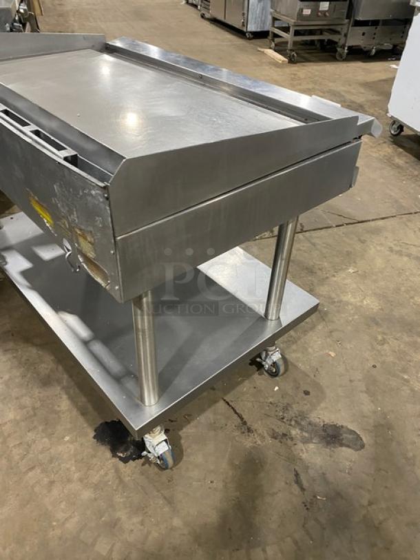 RARE Vulcan commercial stainless steel natural gas countertop flat griddle with back & side splash, undershelf cart, on casters.