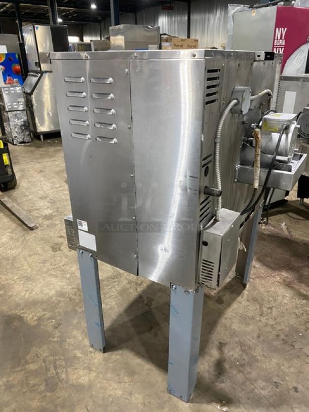 American Range stainless steel gas convection oven, single stack, with wired rack, on legs, in used condition.