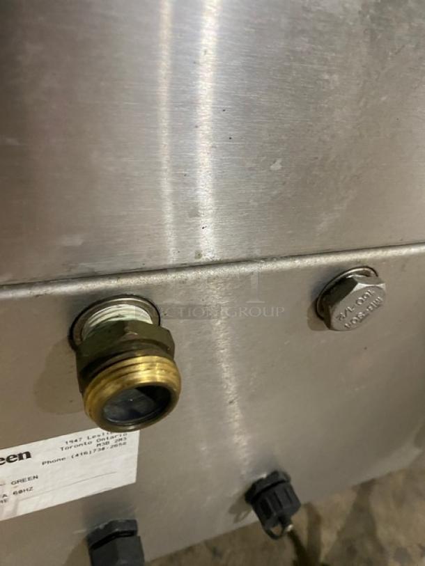 Totally Green ORCA Series OG25 stainless steel food waste digester with control label, brass fitting, and caster wheels.