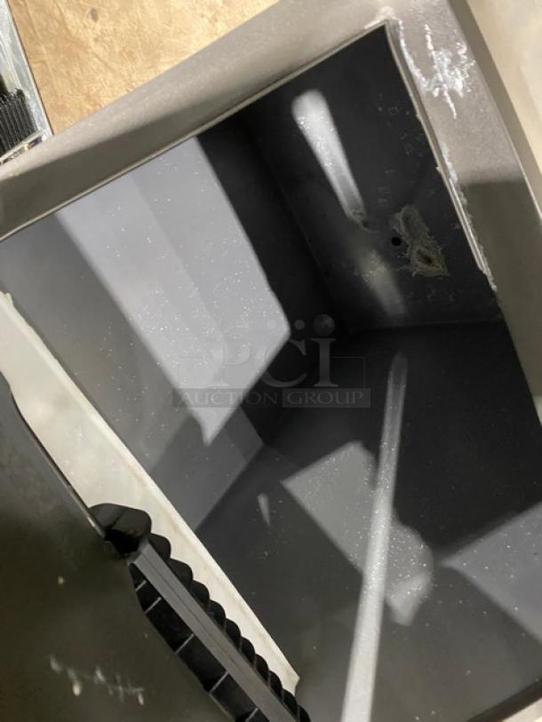 Manitowoc Indigo NXT ice maker bin, clean interior, stainless steel, Model IY1106A261, Energy Star certified, on legs.