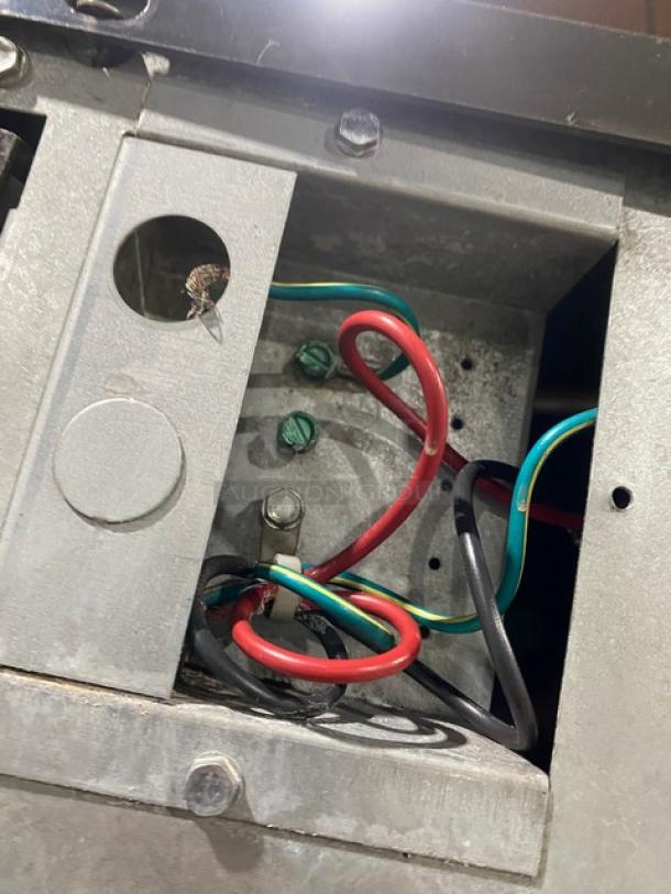 Interior view of Manitowoc Indigo NXT Series IY1106A-261 ice machine, showing wiring and components. Model: IY1106A-261.