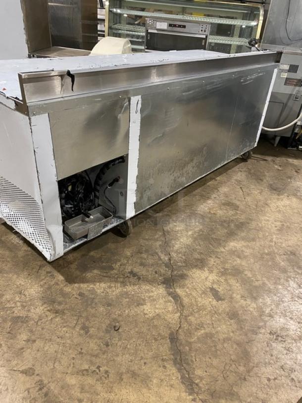 Custom Cool LB93SC stainless steel refrigerated worktop table, 93" long, three doors, built-in pan rack, on casters, 115V.