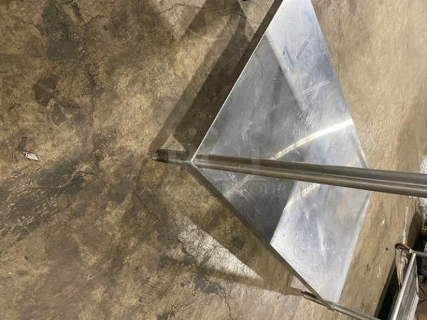 Commercial stainless steel single undershelf equipment stand on legs, durable and sturdy, ideal for kitchen use.