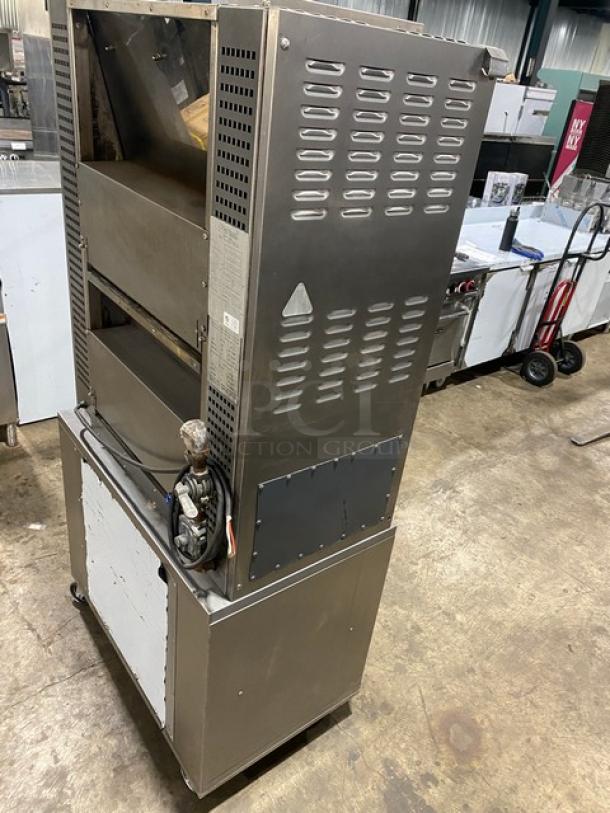 Rotisol stainless steel rotisserie oven, Model 9505, natural gas, tempered glass doors, pull-out workstation, casters.