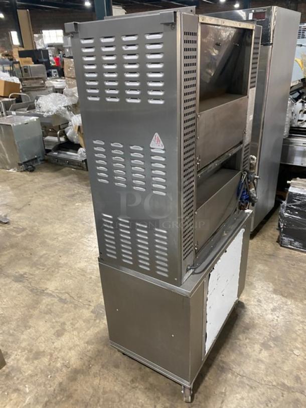Rotisol commercial stainless steel rotisserie oven, model 9505, with tempered glass swing doors, retractable workstation, and base cabinet on casters.