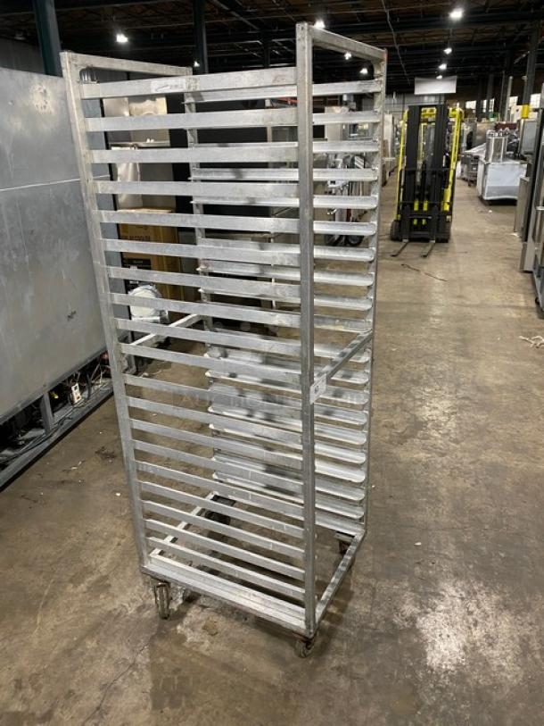 Commercial stainless steel sheet pan rack on casters, multi-tier, durable, used condition, ideal for bakeries and kitchens.