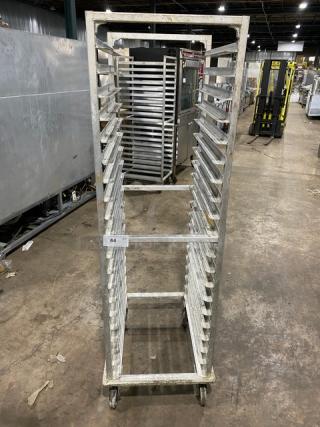 Commercial stainless steel sheet pan rack on casters, used condition, holds multiple pans, tag marked "64".