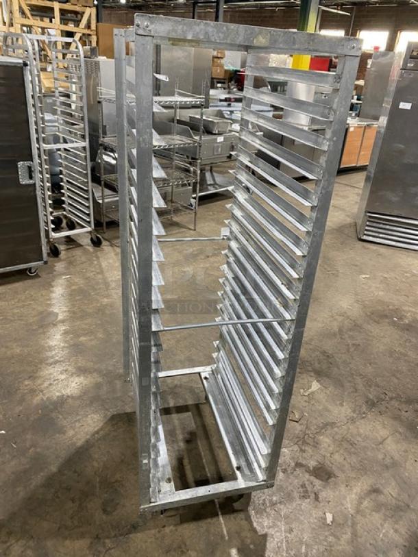 Commercial stainless steel sheet pan rack with multiple slots on casters. Durable and suitable for heavy-duty use.