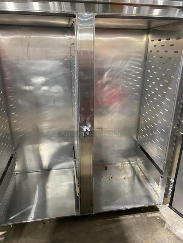 Continental DL2NISA stainless steel two-section reach-in refrigerator, Energy Star certified. Good condition, visible inside view.