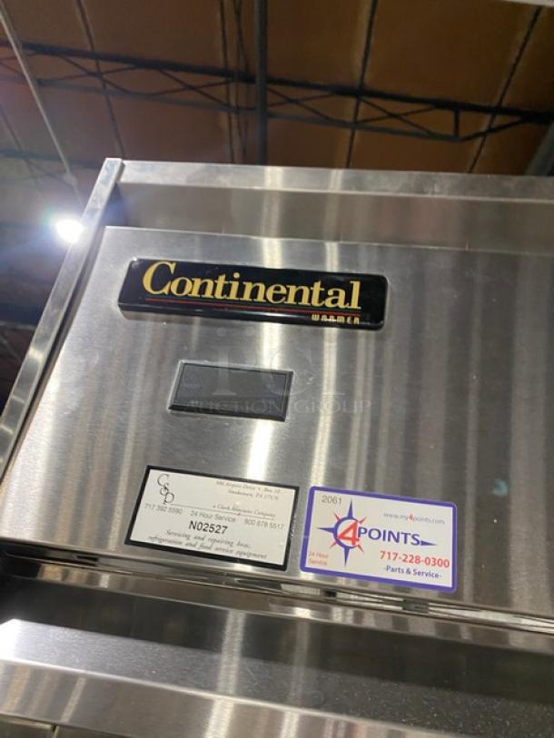 Continental DL2NISA stainless steel two-door reach-in refrigerator, Energy Star certified, tags include model and service info.