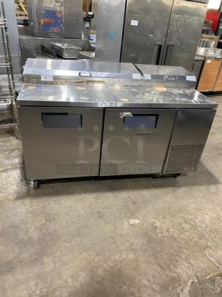 True TPP-67 stainless steel 2-door refrigerated pizza prep table on casters. Model TPP-67, SN: 1-4237102, 115V 1 Phase.