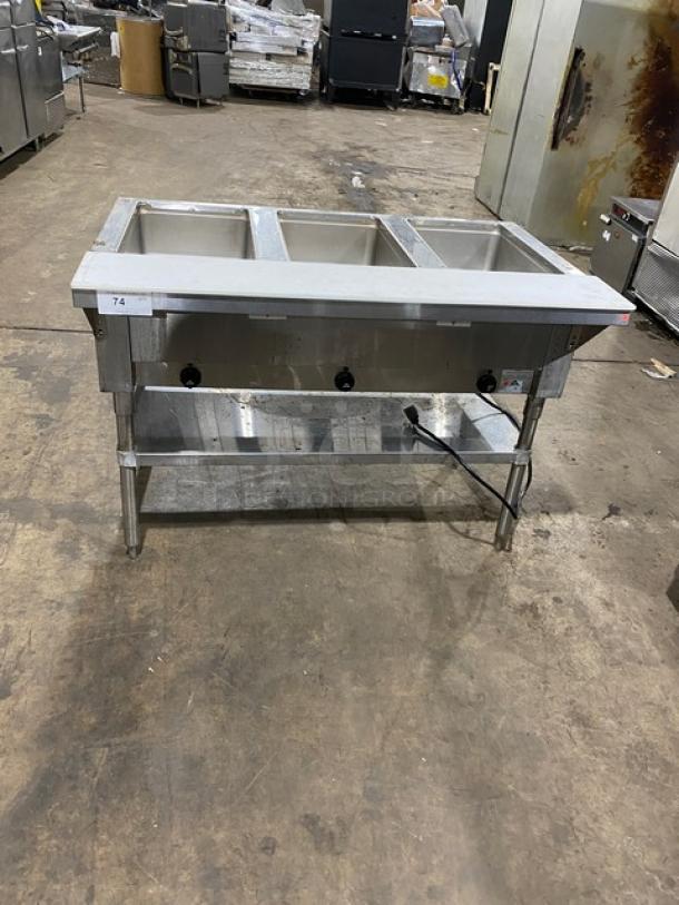 Advance Tabco stainless steel 3-pan hot food well, model SW-3E-240-SUP, with undershelf and cutting board, 208/240V 1 Phase.