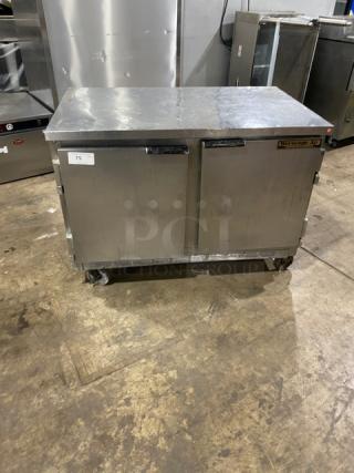 Beverage Air stainless steel 2-door refrigerated worktop cooler with poly coated rack, on casters. Signs of use visible.