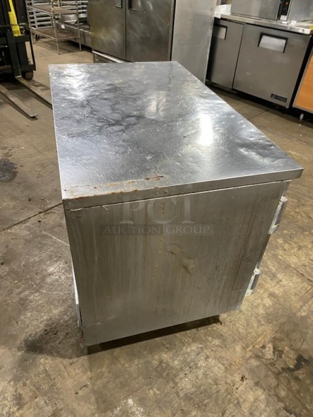 Beverage Air commercial stainless steel 2-door refrigerated worktop cooler. Features poly-coated wired rack and casters. Moderate wear.