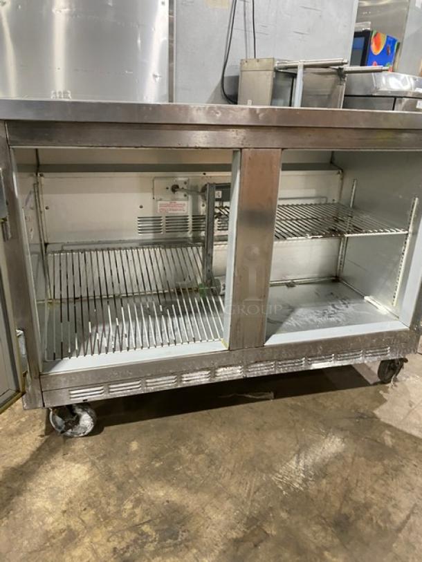 Beverage Air stainless steel 2-door refrigerated cooler with poly-coated wired rack on casters. Commercial worktop model.