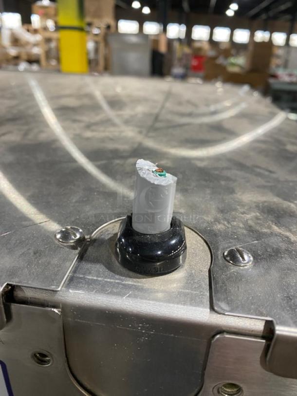 Stainless steel top of Metro C5 heated holding cabinet showing a broken knob, surface wear, and visible screws.