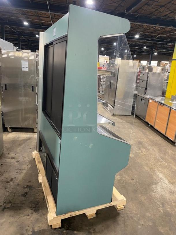 Commercial refrigerated open-air multi-tier grab-n-go merchandiser display case with rear access sliding doors, good condition.