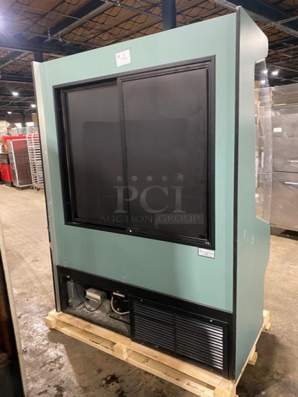 Commercial refrigerated open-air multi-tier merchandiser with rear sliding doors, mint condition, visible ID tag.