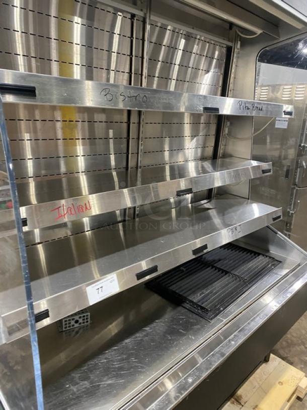 Commercial refrigerated open-air multi-tier grab-n-go merchandiser with rear access sliding doors; stainless steel, excellent condition.
