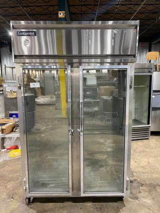 Continental 2FQD stainless steel commercial freezer, dual glass swing doors, poly coated wire racks, on casters.