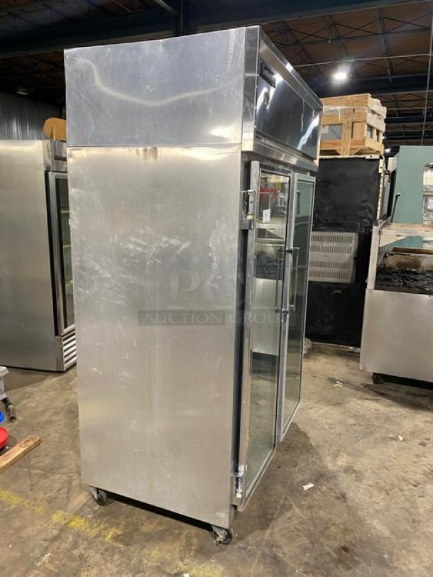 Continental 2F-QD commercial stainless steel reach-in freezer with glass swing doors, poly coated racks, on casters.