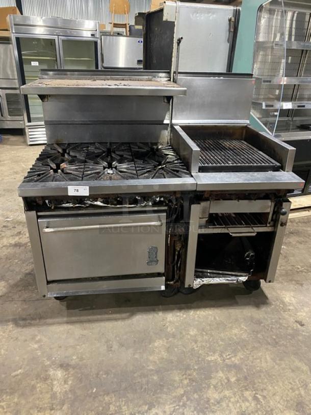 Montague stainless steel range and char broiler combo with six burners, cheese melter, full-size oven, on casters.