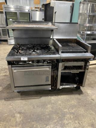 Montague stainless steel range and char broiler combo with six burners, cheese melter, full-size oven, on casters.