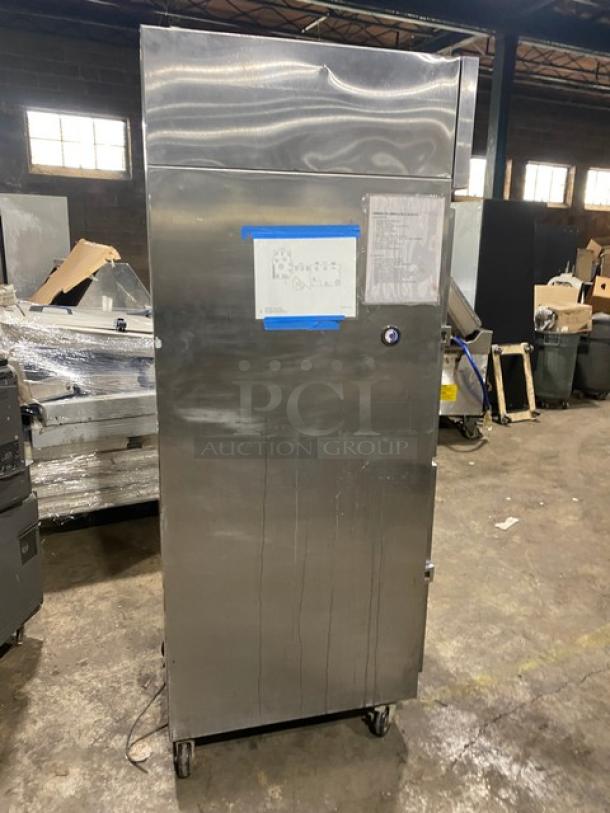 Continental Commercial Stainless Steel Half Door Refrigerator, Model 1RSSHD, on casters, in good condition, with visible label.