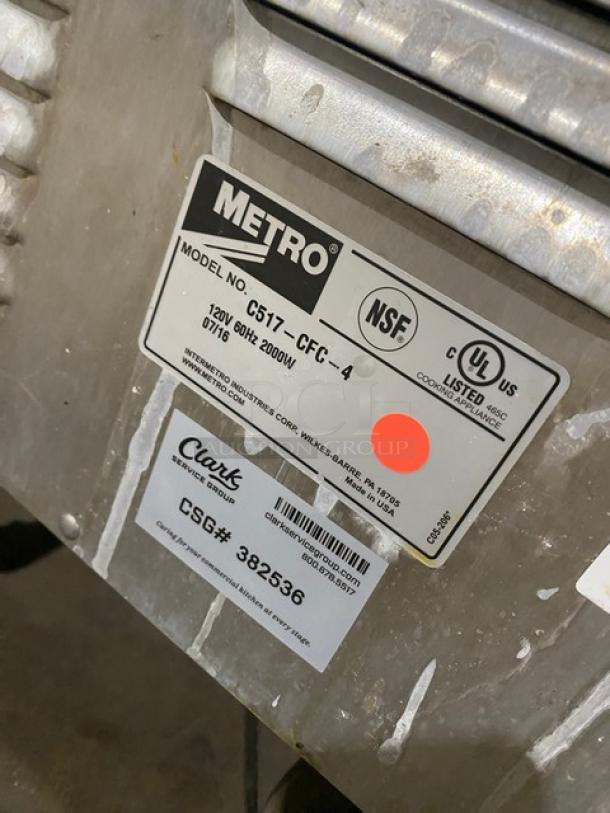 Metro C517CFG4 heat/proof cabinet; single glass door; digital controls; built-in pan slide; model/serial tags visible; on casters.