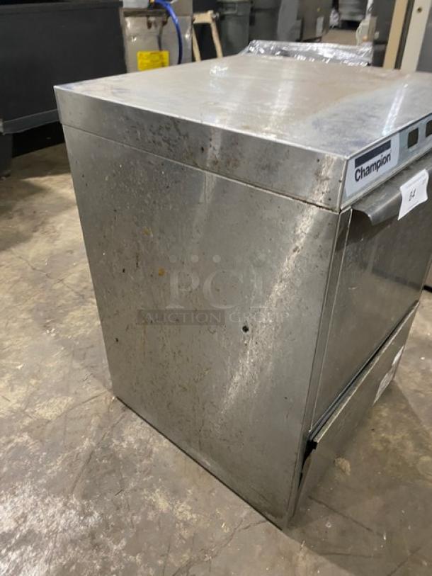 Champion UH130BM4 stainless steel undercounter dishwasher, electric-powered, high-temp, gently used, visible wear on surface.