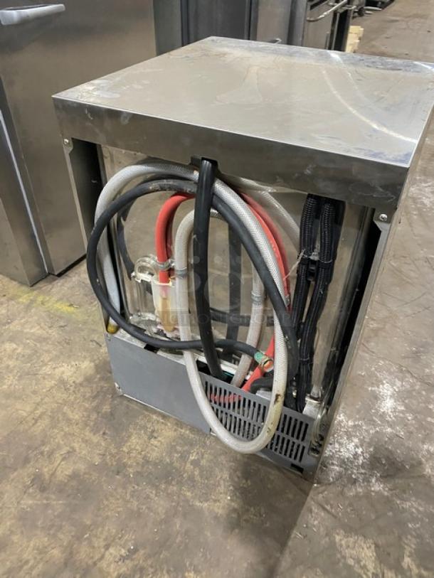 Champion UH130BM4 stainless steel undercounter dishwasher. High-temperature model, electric, visible hoses, lightly used condition.