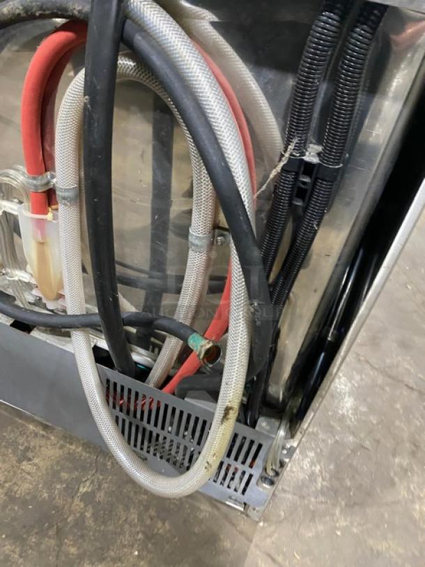 Champion UH130BM4 Commercial Undercounter Dishwasher, stainless steel, electric, high-temp, Model UH130B-M4, SN: W150954436, 120-208/230V, 1 Phase, visible hoses and wiring.