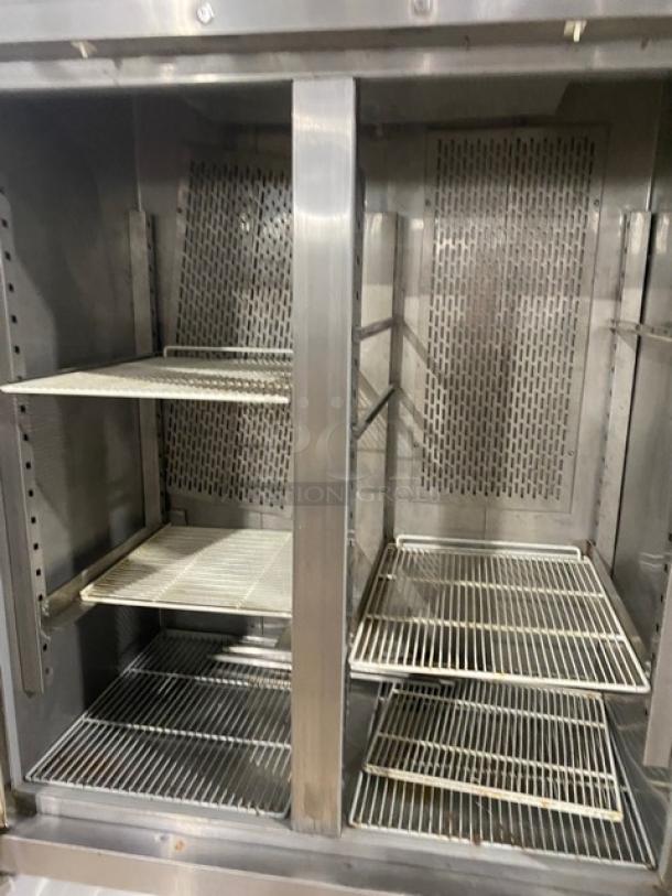 Avantco CFD-2RR commercial stainless steel 2-door reach-in refrigerator, includes poly coated wired racks, on casters.