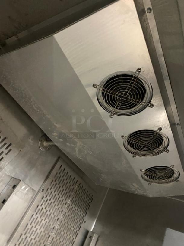 Avantco CFD2RR commercial stainless steel reach-in refrigerator interior, featuring poly-coated wired rack and fan vents.