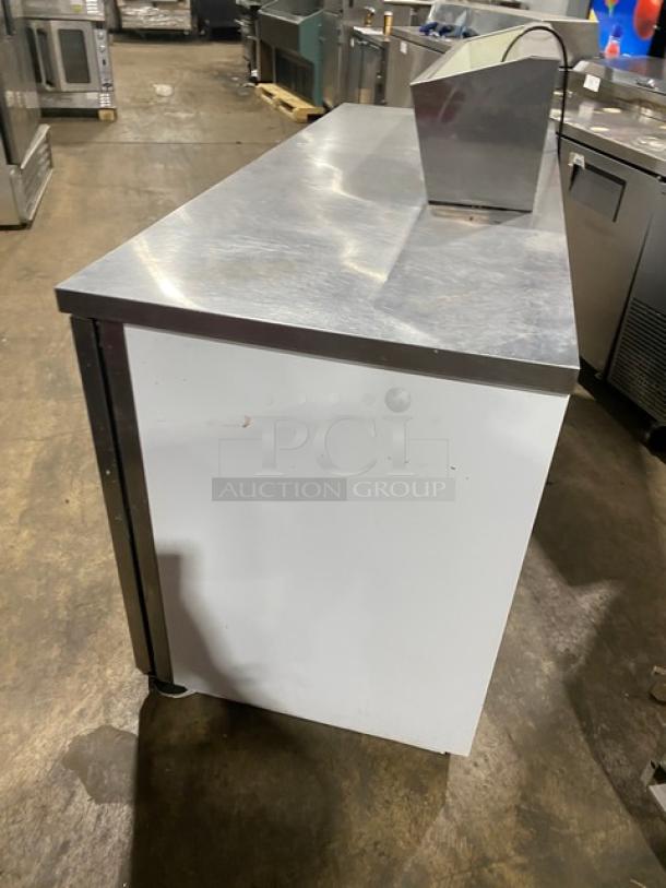 Beverage Air commercial stainless steel pizza prep table, large workspace, two-door cold storage, poly-coated rack.