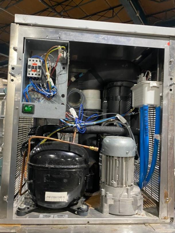 Manitowoc stainless steel ice machine, model RNF0620W, air-cooled, 115V, 1 phase, on legs. Appears in used condition.