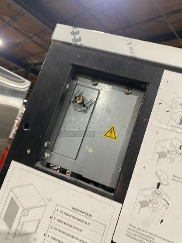 Manitowoc stainless steel ice machine, model RNF0620W, on legs. Features air-cooling, 115V, 1-phase. Serial: M09185552018.