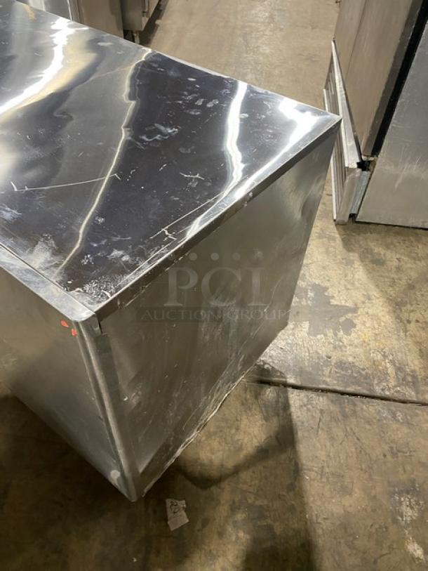 Hoshizaki KM1601SWH3 stainless steel undercounter ice machine, water-cooled, crescent ice, scratches on surface, 208-230V, 3-phase.