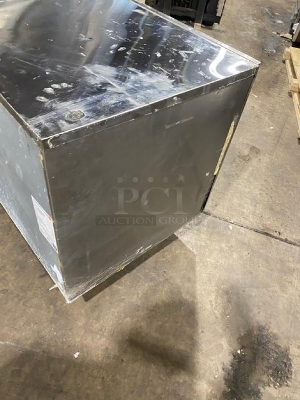 Hoshizaki KM1601SWH3 commercial ice maker, stainless steel, electric, undercounter model. Some surface wear visible.