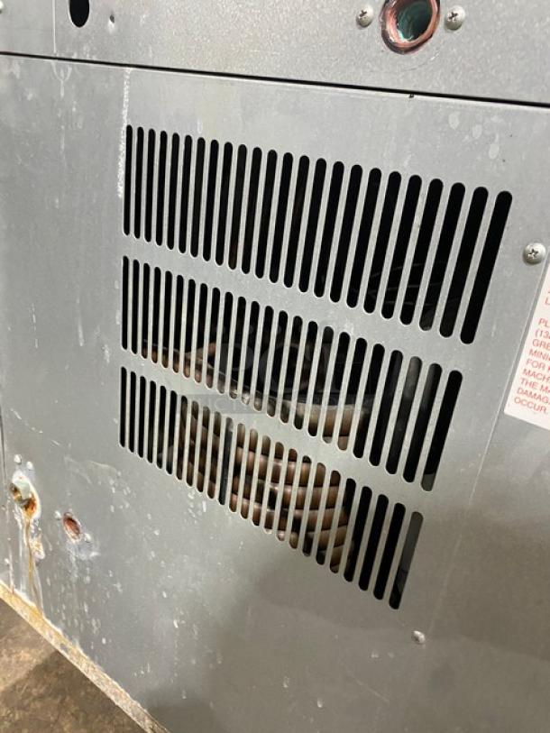 Hoshizaki KM1601SWH3 commercial ice maker, stainless steel, water-cooled, 208-230V, undercounter, visible wear.