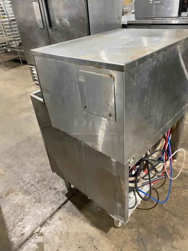 CMA commercial stainless steel undercounter bar dishwasher, model GL-C, on legs. Visible wear, functional components exposed.