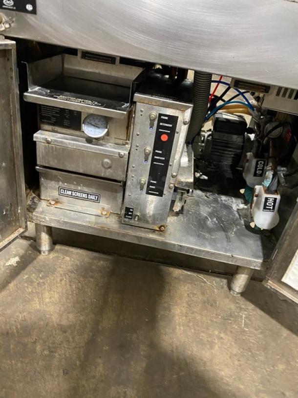 CMA Commercial Stainless Steel Undercounter Bar Dishwasher, Model GL-C. Features carousel style, on legs. Visible wear, clean screens daily label.