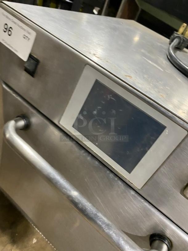 MerryChef commercial stainless steel turbo oven, features high-speed rapid cook, touch screen, with wired oven rack, in good condition.