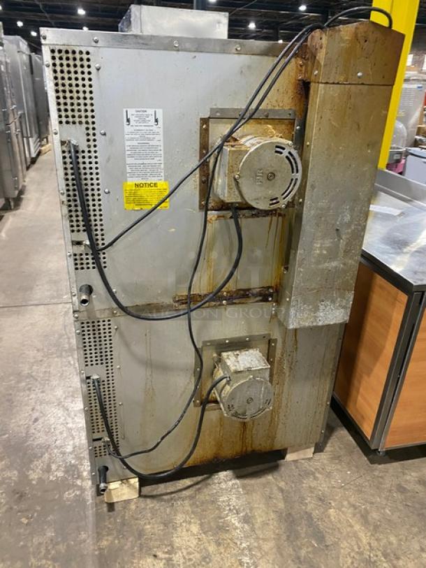 Southbend commercial natural gas double convection oven, stacked design with wired rack, visible wear and wiring on the back.
