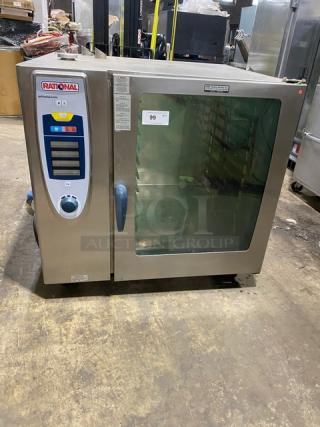 Rational SelfCooking Center SCC102G commercial combi oven, stainless steel, with wired oven rack, on legs, model label visible.