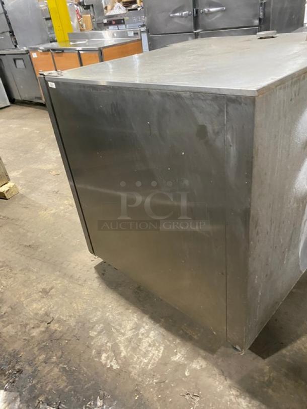 Rational SelfCooking Center SCC102G commercial combi oven, stainless steel, electric, with wired rack, on legs.