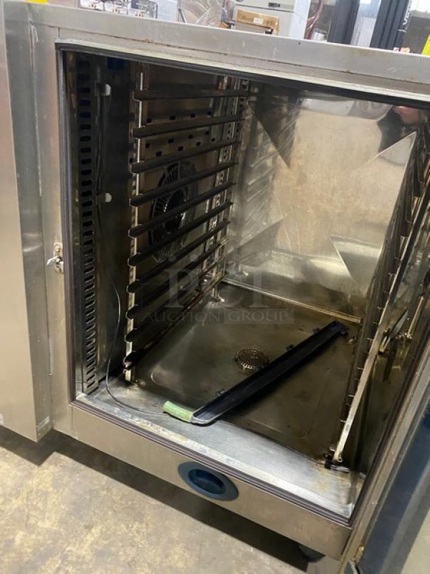 Rational SCC102G SelfCooking Center, stainless steel combi oven, electric, with wired rack, on legs, good condition.